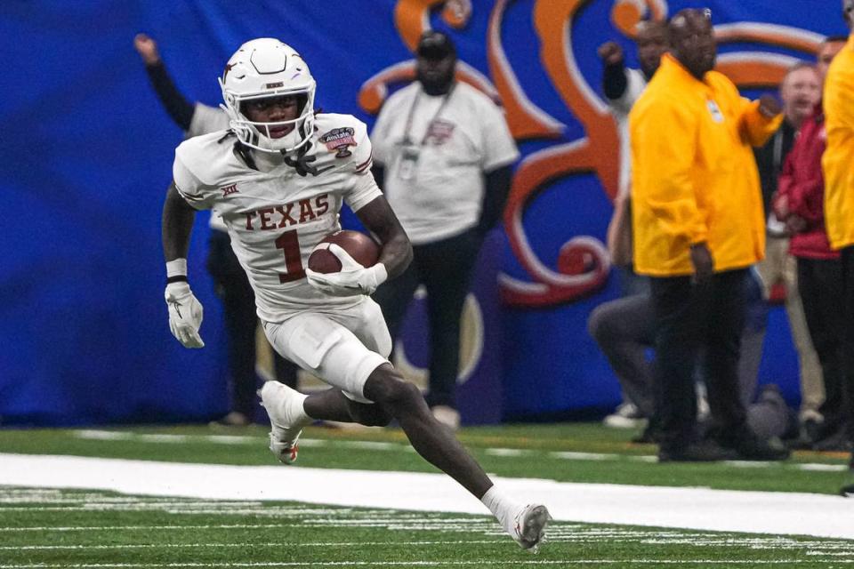 Texas Longhorns wide receiver Xavier Worthy (1) runs the ball during the Sugar Bowl College Football Playoff semifinals game against the Washington Huskies at the Caesars Superdome on Monday, Jan. 1, 2024 in New Orleans, Louisiana. Aaron E. Martinez/American-Statesman/Aaron E. Martinez/American-Statesman / USA TODAY NETWORK