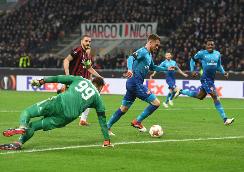 Aaron Ramsey takes the ball around AC Milan goalkeeper Gianluigi Donnarumma to score at the San Siro