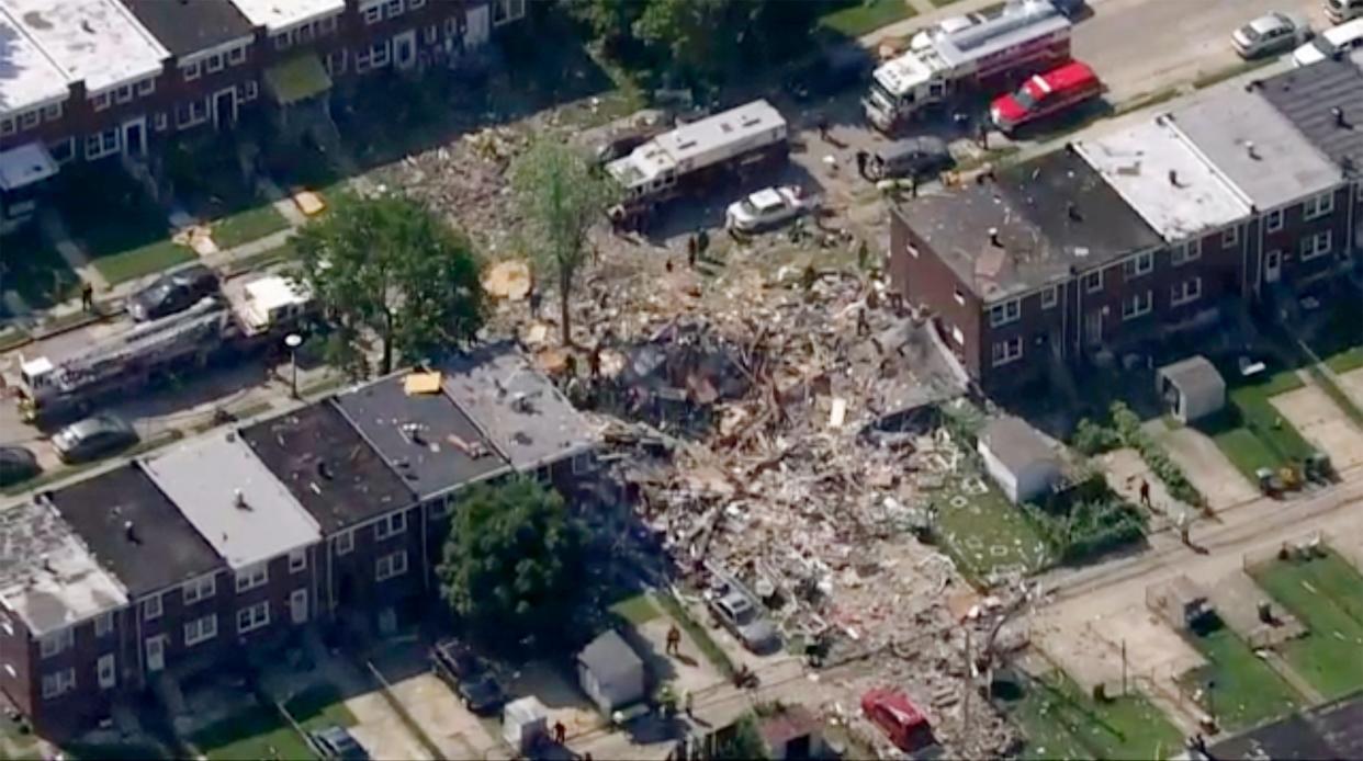 The scene of an explosion in Baltimore on Monday, 10 August, which leveled several homes: WJLA-TV via AP