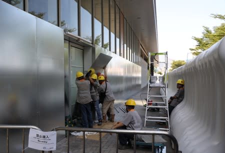 Workers reinforce doors to the Legislative Council Complex, in central Hong Kong