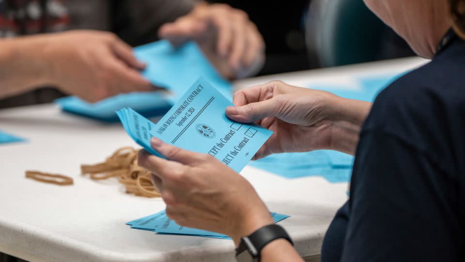 IAM union members count votes on a contract offer Boeing. Rank-and-file members voted overwhelmingly to reject the tentative labor deal with the company and to go on strike. - Stephen Brashear/AP