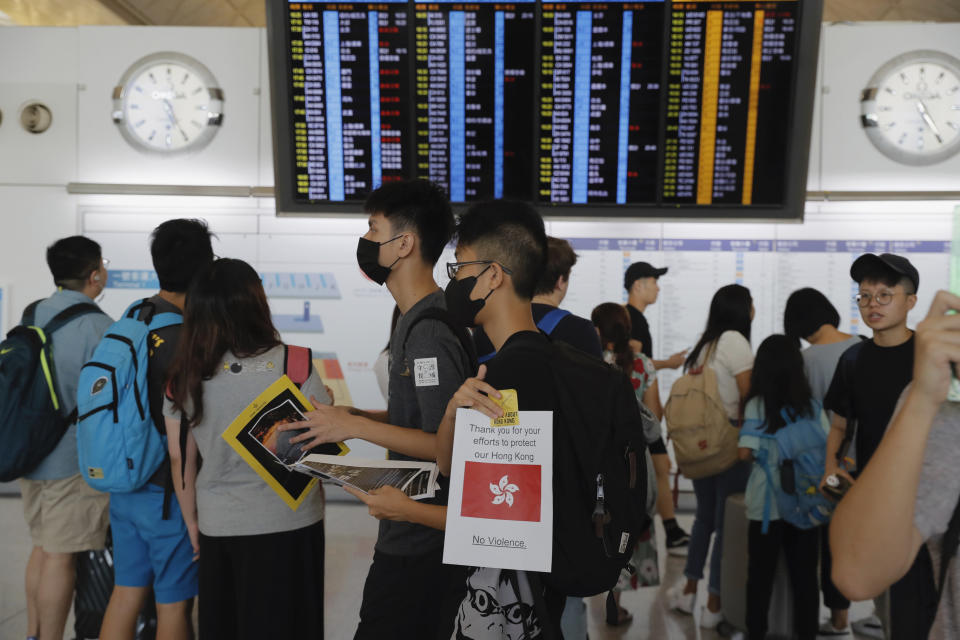 Protesters take part in a second day of protest at the airport in Hong Kong on Saturday, Aug. 10, 2019. Hong Kong is in its ninth week of demonstrations that began in response to a proposed extradition law but have expanded to include other grievances and demands for more democratic freedoms. (AP Photo/Kin Cheung)