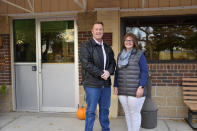 Ken and Kelly Speidel stand outside the community hall of Cascade, Mont., Friday, Oct. 15, 2021. The Speidels own a horse boarding business in Cascade, a rural community on the banks of the Missouri River. For the first time in 30 years, the Census has awarded Montana a second seat in Congress and a commission is being tasked with determining how to divide the state into two congressional districts. (AP Photo/Iris Samuels)