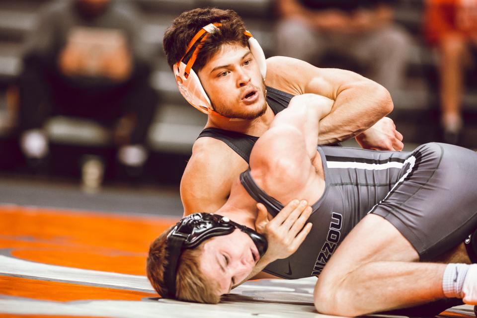 Oklahoma State's Reece Witcraft, top, was unseeded in the Big 12 Championships, but reached the semifinals on Saturday.