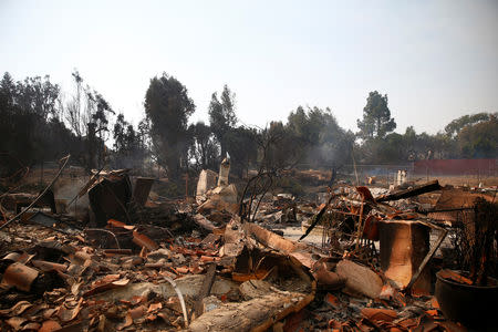 A destroyed home is seen as the Woolsey Fire continues to burn in Malibu, California, U.S. November 10, 2018. REUTERS/Eric Thayer