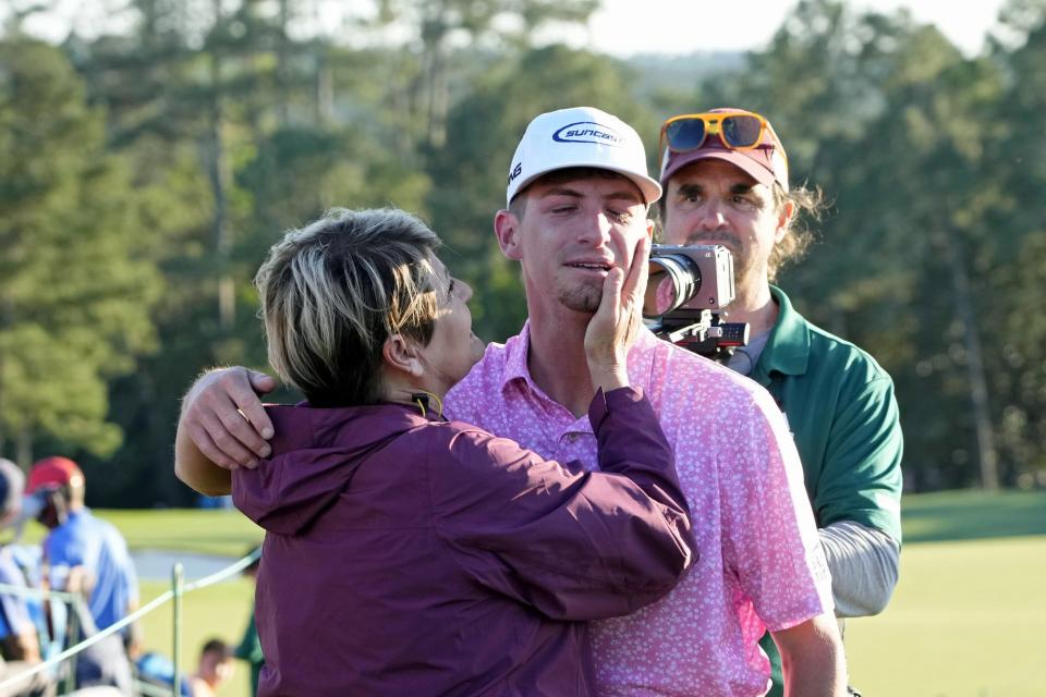 Apr 9, 2023; Augusta, Georgia, USA; Sam Bennett with his mom Stacy Bennett after completing the final round of The Masters golf tournament. Mandatory Credit: Michael Madrid-USA TODAY Network