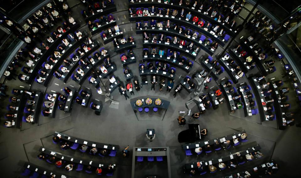 File - In this Thursday, Jan. 17, 2019 file photo German lawmakers attend a special parliament session at the Reichstag building, host of the German federal parliament, Bundestag, in Berlin, Germany, to celebrate 100 years of women's suffrage in Germany. Hundreds of immigrants are running in Germany's national election on Sunday, raising the possibility of making its next parliament more diverse than ever. While it still might not fully represent the country's overall diversity, where more than a quarter of the population has immigrant roots, it's a step toward a more accurate reflection of society. (AP Photo/Markus Schreiber,File)