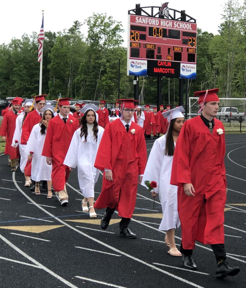 Graduates of the Class of 2023 arrive at Alumni Stadium for Sanford High School's graduation ceremony on Wednesday, June 7, 2023.