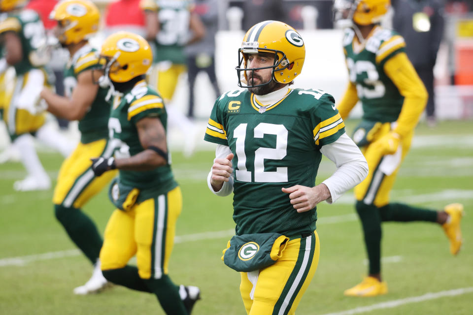 GREEN BAY, WISCONSIN - JANUARY 24: Aaron Rodgers #12 of the Green Bay Packers warms up prior to their NFC Championship game against the Tampa Bay Buccaneers at Lambeau Field on January 24, 2021 in Green Bay, Wisconsin. (Photo by Dylan Buell/Getty Images)