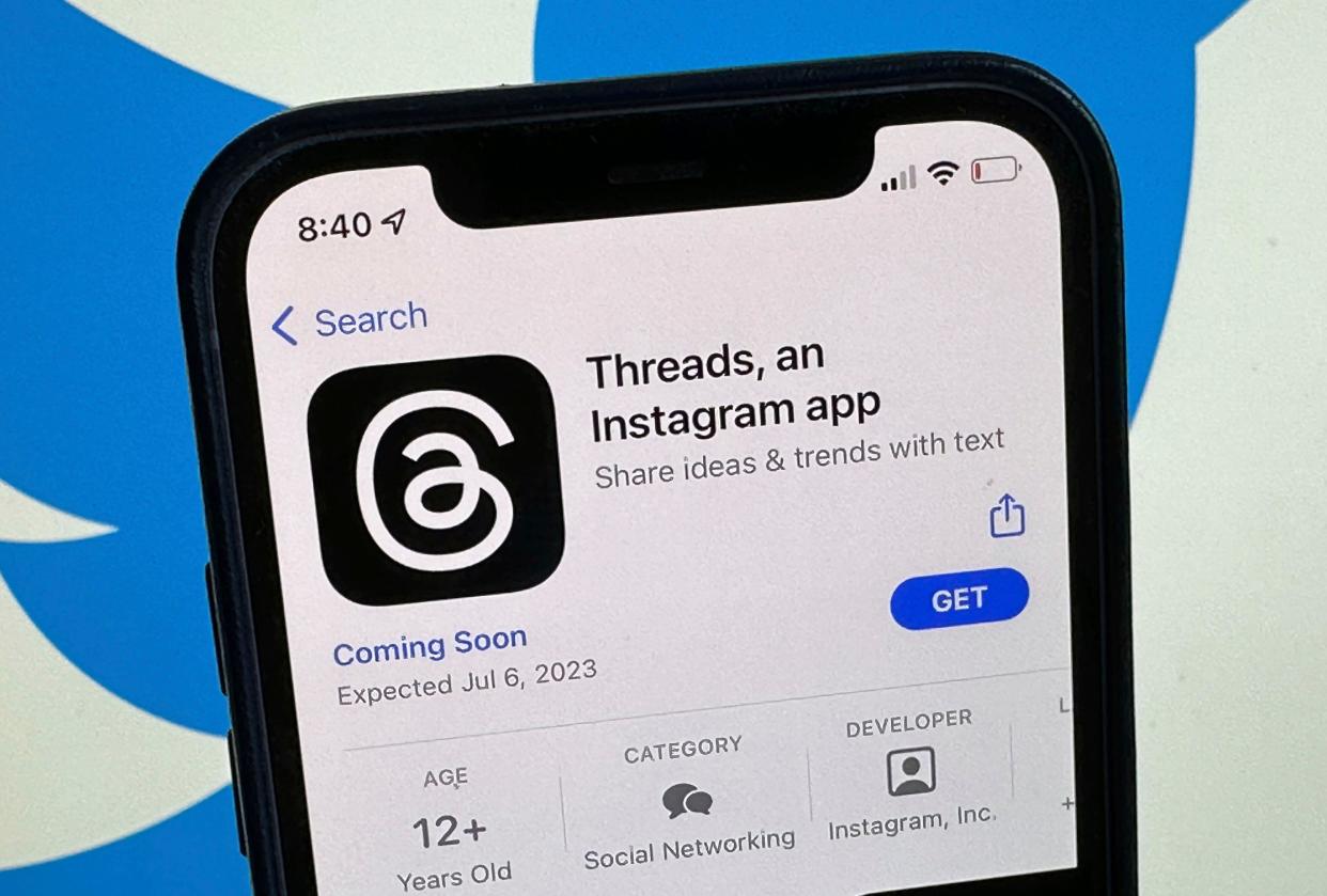 The announcement of the social media app 'Threads' is displayed in Apple's US App Store seen on the screen of a smartphone in Berlin, Germany, Tuesday, July 4, 2023. Meta is poised to launch a new app that appears to mimic Twitter in a direct challenge to the social media platform owned by billionaire Elon Musk. A listing for the app, called Threads, appeared on Apple’s App Store, indicating it would debut as early as Thursday. (Christoph Dernbach/dpa via AP)