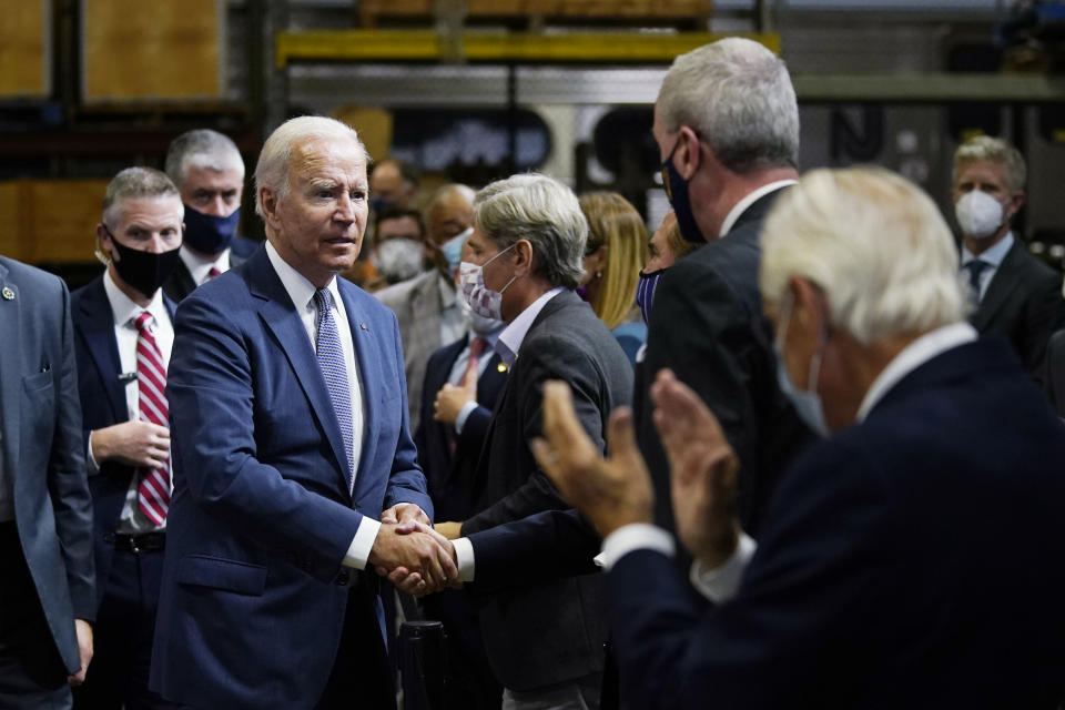 President Joe Biden greets the audience after delivering remarks at the NJ Transit Meadowlands Maintenance Complex to promote his "Build Back Better" agenda, Monday, Oct. 25, 2021, in Kearny, N.J. (AP Photo/Evan Vucci)