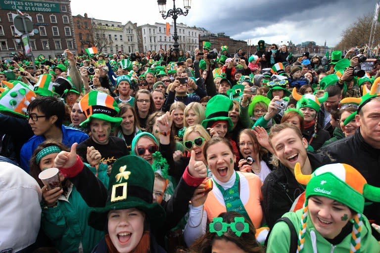 Parade goers shout as they watch St Patrick's Day festivities in Dublin, Ireland.