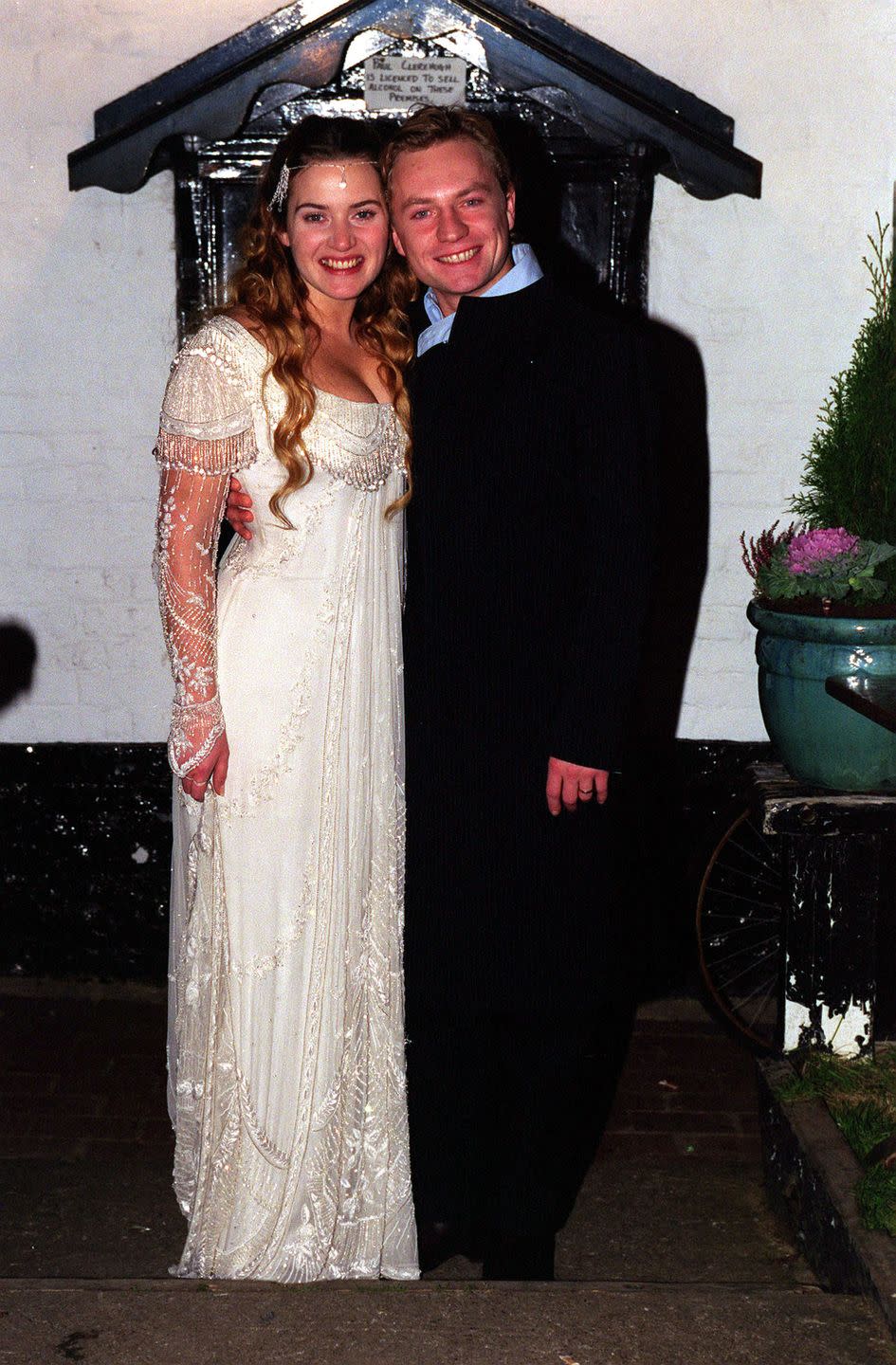 <p>Kate Winslet and her new husband Jim Threapleton are all smiles as they pose in front of their reception venue, the Crooked Billet pub in Oxfordshire in 1998. </p>