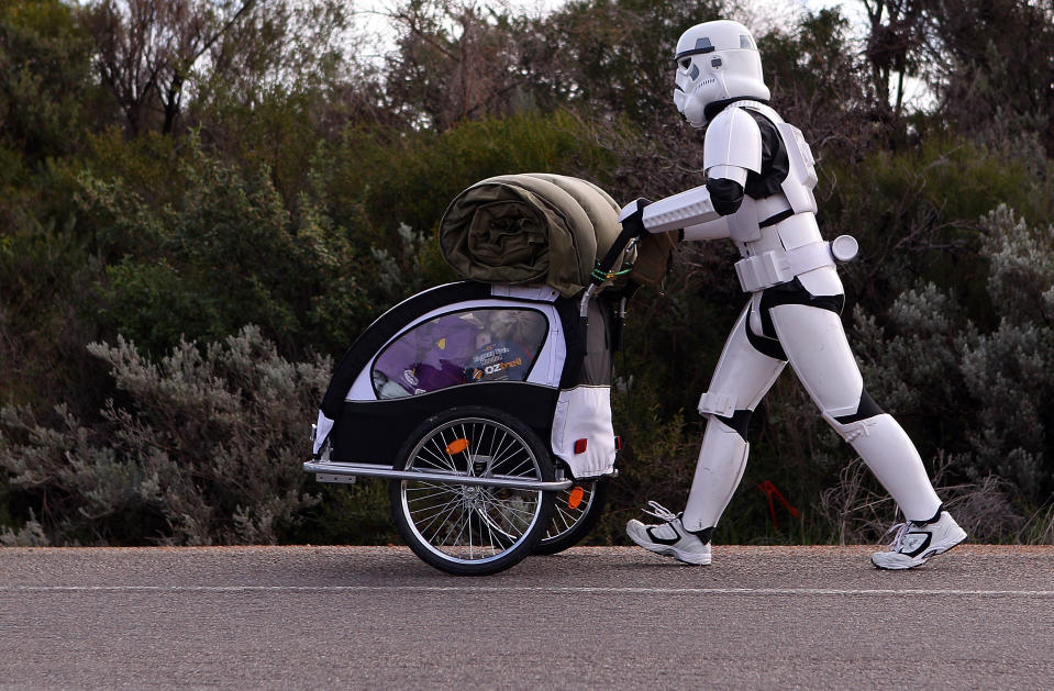 PERTH, AUSTRALIA - JULY 15: Stormtrooper Paul French is pictured on day 5 of his over 4,000 kilometre journey from Perth to Sydney walks along Old mandurah road approximately 20 kilometres from Mandurah on July 15, 2011 in Perth, Australia. French aims to walk 35-40 kilometres a day, 5 days a week, in full Stormtrooper costume until he reaches Sydney. French is walking to raise money for the Starlight Foundation - an organisation that aims to brighten the lives of ill and hostpitalised children in Australia. (Photo by Paul Kane/Getty Images)