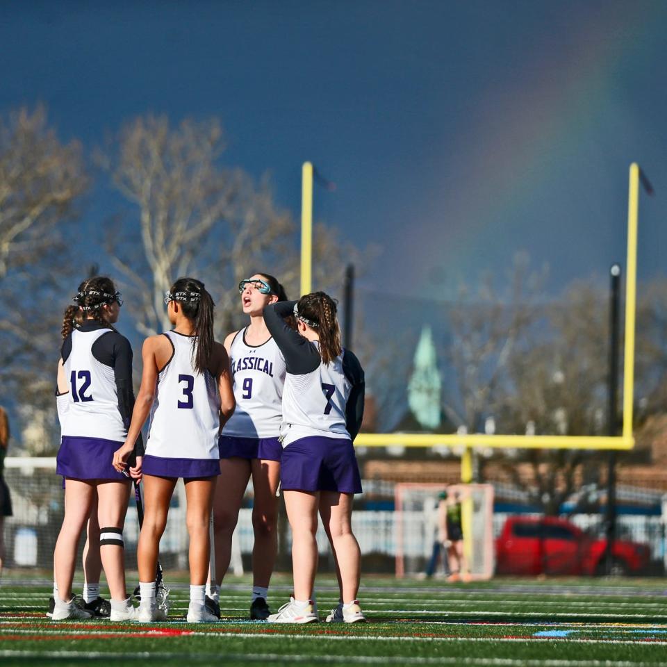 Rayya Frayn gathers the Classical defense as a rainbow shines on the horizon during the second quarter of the Purple's game against North Smithfield on Wednesday.
