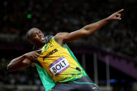 LONDON, ENGLAND - AUGUST 05: Usain Bolt of Jamaica celebrates winning gold in the Mens 100m Final on Day 9 of the London 2012 Olympic Games at the Olympic Stadium on August 5, 2012 in London, England. (Photo by Michael Steele/Getty Images)