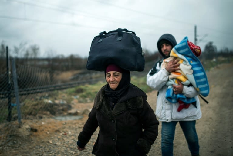 Migrants make their way across the Macedonia-Serbia border at Tabanovce on February 4, 2016