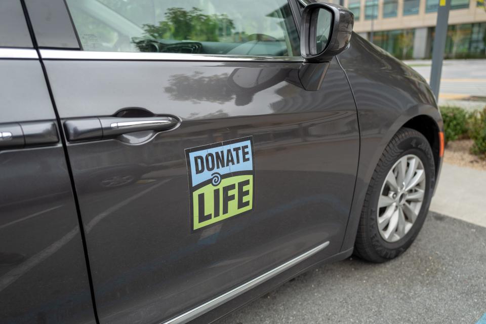 A sign on a Prius says: Donate Life.