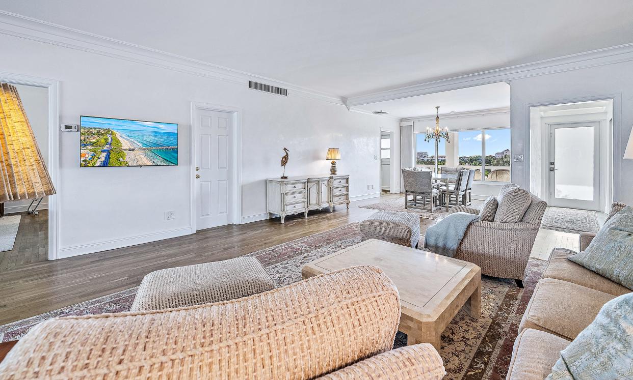 The living area has a south-facing alcove for formal dining next to the foyer and front door.