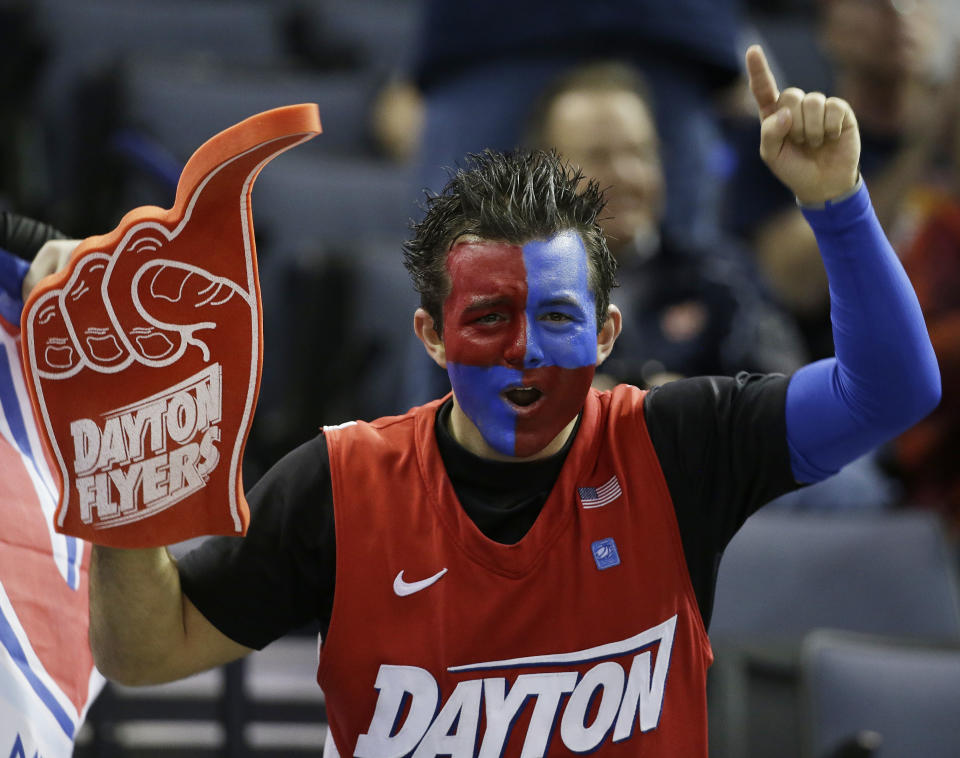 A Dayton fan cheers before the first half in a regional semifinal game against Stanford at the NCAA college basketball tournament, Thursday, March 27, 2014, in Memphis, Tenn. (AP Photo/Mark Humphrey)