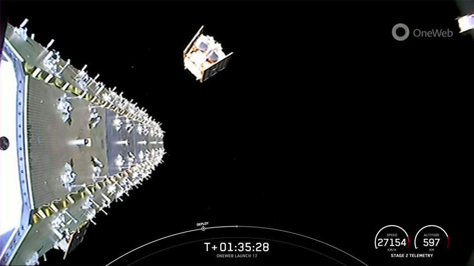 Two of the last four OneWeb satellites launched Thursday drift off into space, one just leaving the second stage dispenser and the other at extreme upper right. Forty OneWeb satellites were deployed in all. / Credit: SpaceX