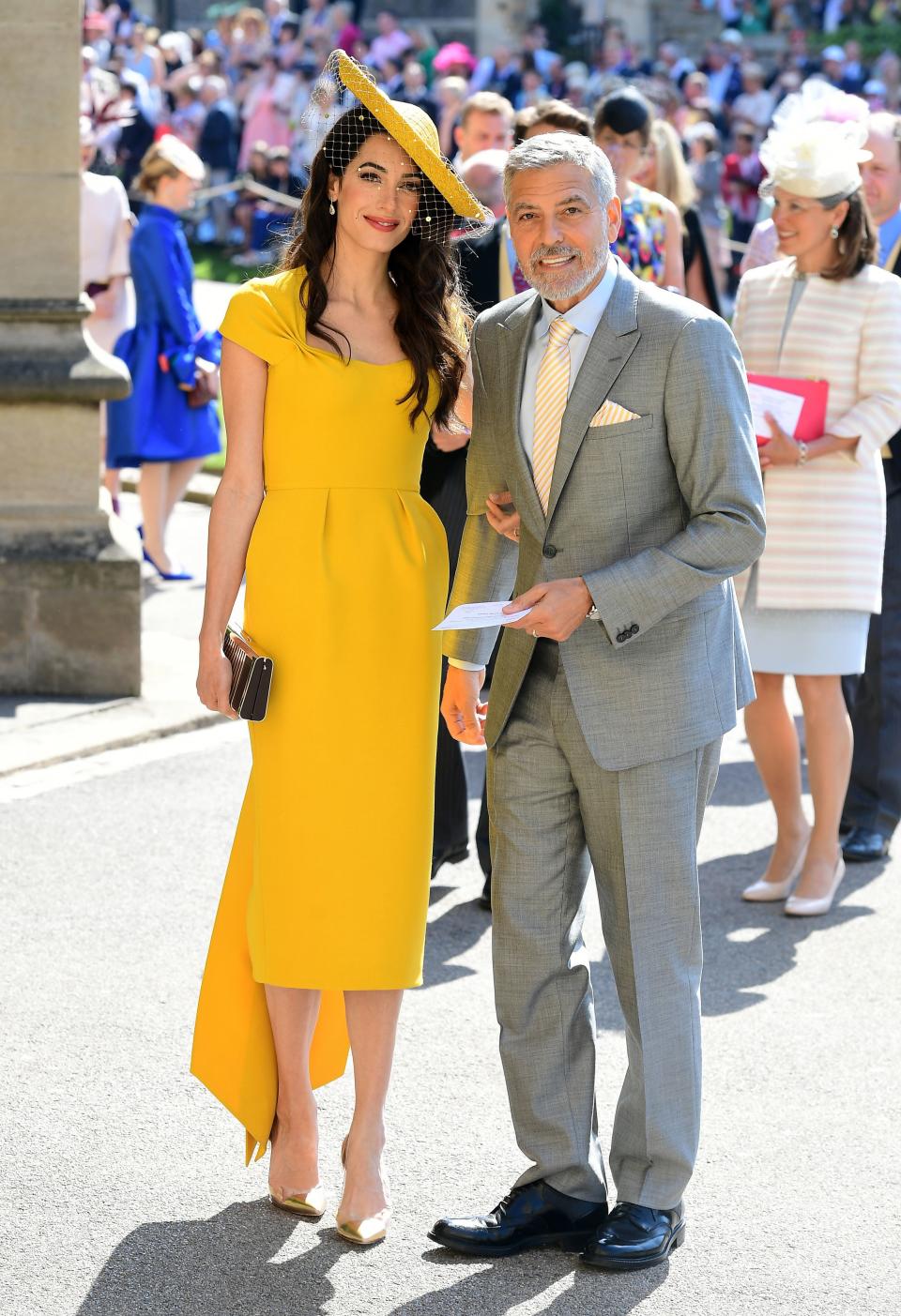 <p>WHO: Amal Clooney</p> <p>WHAT: Custom Stella McCartney, Gianvito Rossi shoes, Lorraine Schwartz jewelry and a Stephen Jones hat</p> <p>WHERE: At the royal wedding, Windsor, England</p> <p>WHEN: May 19, 2018</p>