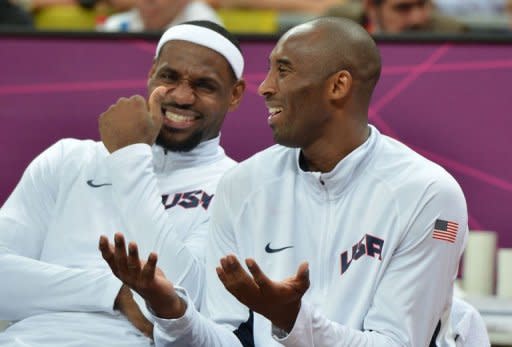 US forward LeBron James (L) chats with US guard Kobe Bryant (R) during the men's preliminary round basketball match USA vs Nigeria of the London 2012 Olympic Games at the basketball arena in London. The United States team of NBA stars set a record for most points in a single Olympic men's basketball game by defeating Nigeria 156-73 on Thursday in a preliminary round game