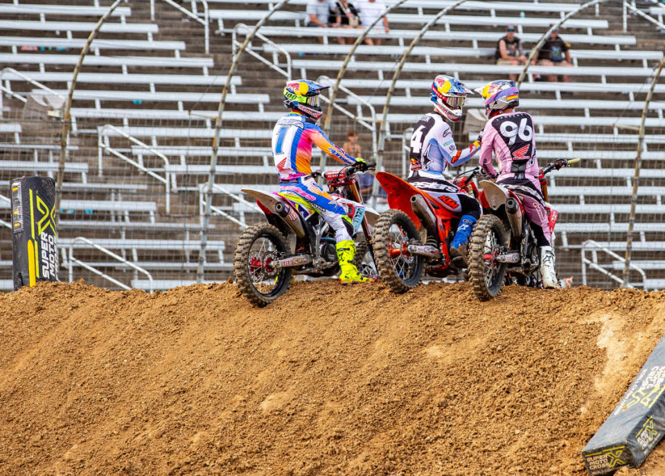 The 450SMX Podium riders Jett Lawrence (3rd), Chase Sexton (2nd) and Hunter Lawrence (1st) show sportmanship after the 450SMX Moto 2 checkered flag.<p>Photo Courtesy of BrownDogWilson</p>