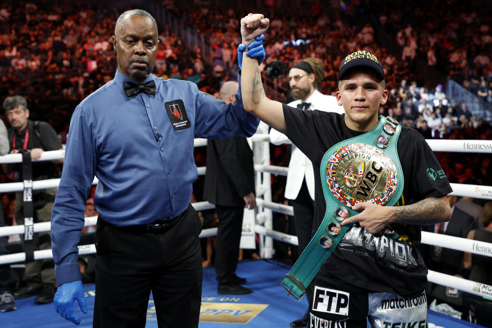 LAS VEGAS, NEVADA - SEPTEMBER 17: Jesse Rodriguez (black and silver trunks) poses with the championship belt after defeating Israel Gonzalez to retain the WBC Super Flyweight Title at T-Mobile Arena on September 17, 2022 in Las Vegas, Nevada. (Photo by Sarah Stier/Getty Images)