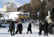 US President Donald Trump, center, arrives in Davos, Switzerland on Marine One, Tuesday, Jan. 21, 2020. President Trump arrived in Switzerland on Tuesday to start a two-day visit to the World Economic Forum. (AP Photo/Evan Vucci)