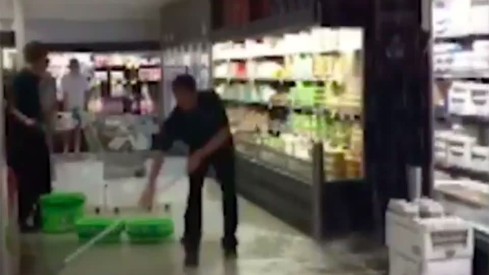 Staff tried to keep their cool as the Melbourne Woolworths began to flood. Source: 7 News