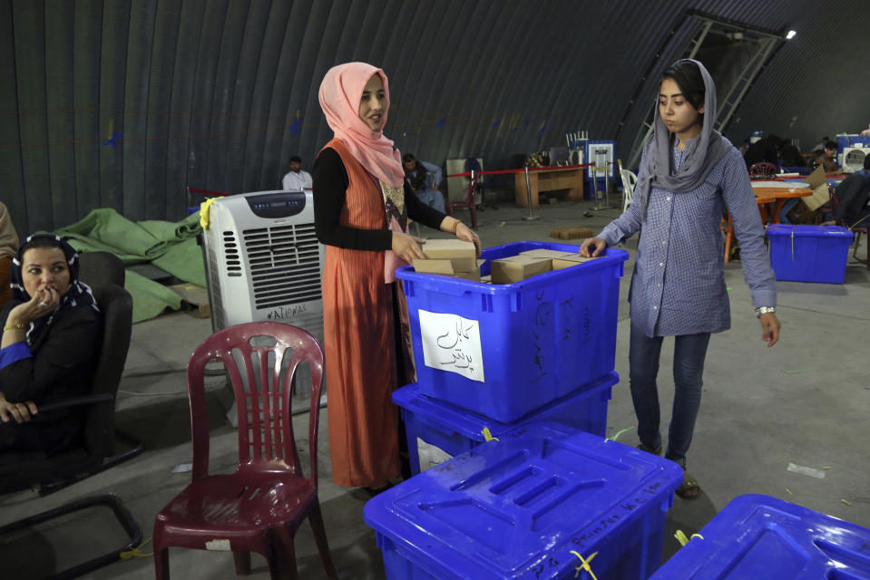 Election commission workers prepare ballot boxes and election materials for the presidential election scheduled for Sept 28, at the Independent Election Commission compound in Kabul, Afghanistan, Sunday, Sept. 15, 2019. Afghan officials say around 100,000 members of the country's security forces are ready for polling day. (AP Photo/Rahmat Gul)