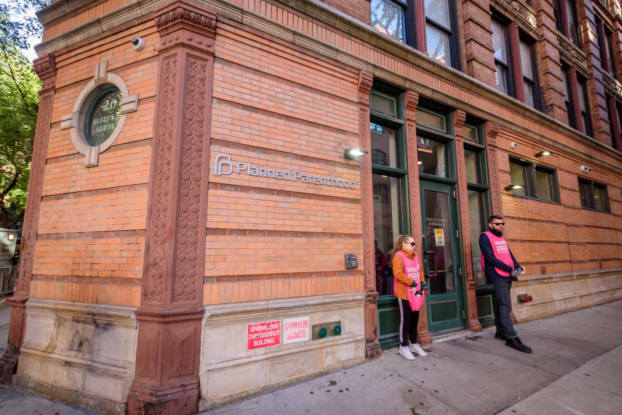 Two volunteers standing at the door of the Planned Parenthood offices in SoHo, Manhattan.