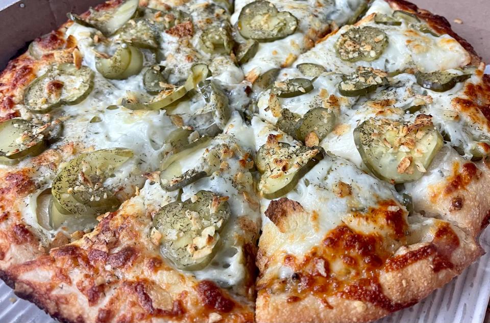 DeCheco's pickle pizza is made using their famous white sauce, a generous helping of pickles, dill seasoning, sour cream and onion Pringles.
