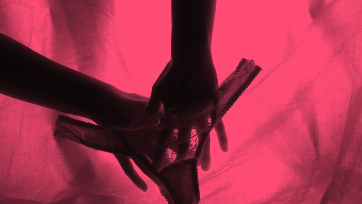Female orgasm represented by a silhouette of two hands and women's underwear on a red background.