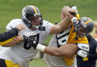 Pittsburgh Steelers center Chris Elkins, left, works on defensive tackle Hebron Fangupo (92) during a blocking drill in practice at NFL football training camp in Latrobe, Pa., on Monday, July 28, 2014 . (AP Photo/Keith Srakocic)