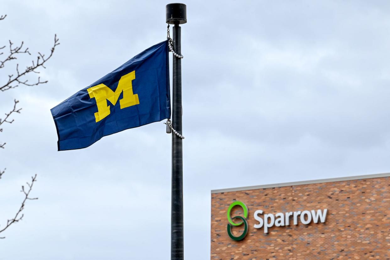 A University of Michigan flag flies outside Sparrow Hospital on Monday, April 4, 2023, in Lansing.