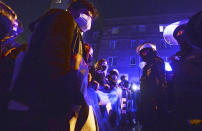 Protesters angry over a new abortion ban face off against police near the parliament in Warsaw, Poland, Wednesday Oct. 28, 2020. People across Poland stayed off their jobs and huge crowds poured onto the streets for a seventh straight day of protests Wednesday, enraged over a top court ruling that bans abortions in cases of fetal abnormalities. (AP Photo/Czarek Sokolowski)