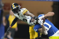 Indianapolis Colts' Michael Pittman Jr. (11) makes a catch against Pittsburgh Steelers' Levi Wallace (29) during the second half of an NFL football game, Monday, Nov. 28, 2022, in Indianapolis. (AP Photo/Michael Conroy)