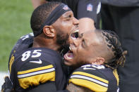Pittsburgh Steelers tight end Eric Ebron (85) celebrates on the sideline with teammate cornerback Joe Haden (23) after making a touchdown catch against the Houston Texans in the first half of an NFL football game, Sunday, Sept. 27, 2020, in Pittsburgh. (AP Photo/Gene J. Puskar)