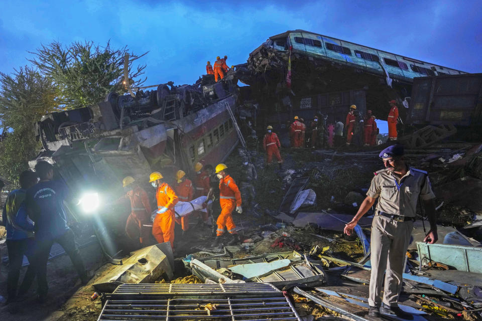 Rescuers carry the body of a victim at the site of passenger trains that derailed in Balasore district, in the eastern Indian state of Orissa, June 3, 2023. / Credit: AP Photo/Rafiq Maqbool