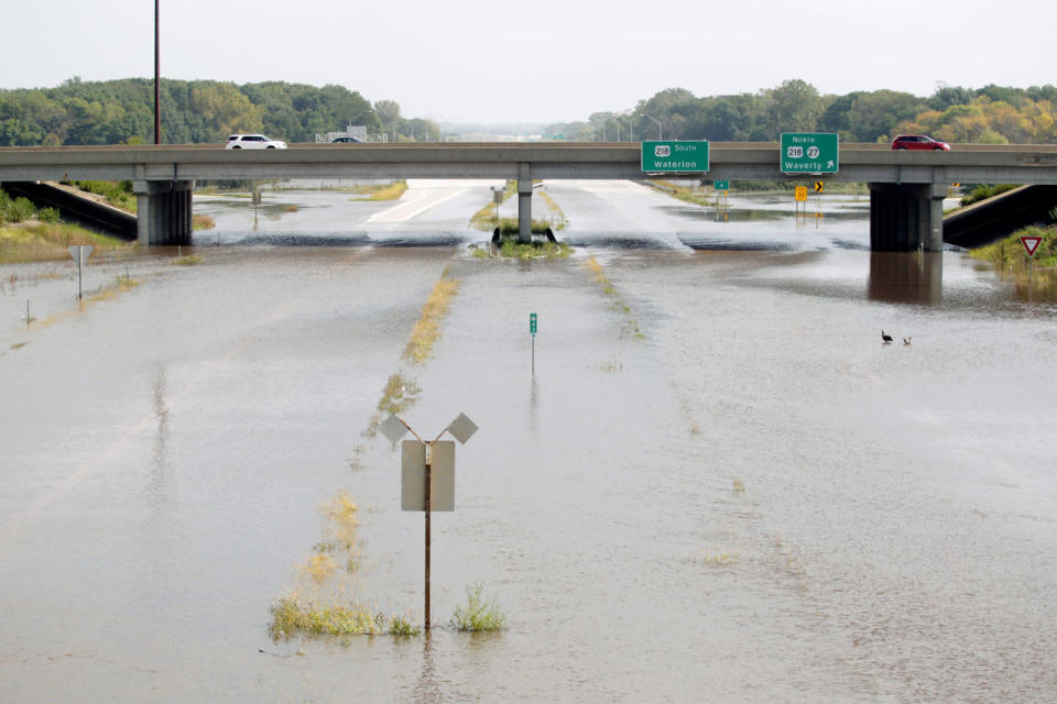 <p>Flood waters spread over Highway 218 Saturday, Sept. 24, 2016, in Cedar Falls, Iowa. (Tiffany Rushing/The Courier via AP)</p>