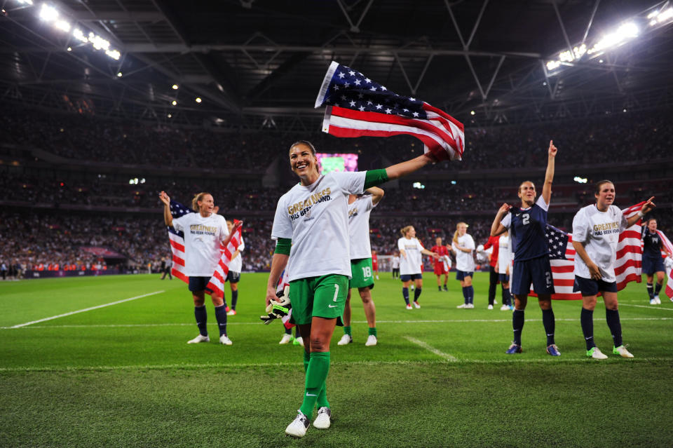 LONDON, ENGLAND - AUGUST 09: Hope Solo #1 of the United States celebrates with the Amrican flag after defeating Japan by a score of 2-1 to win the Women's Football gold medal match on Day 13 of the London 2012 Olympic Games at Wembley Stadium on August 9, 2012 in London, England. (Photo by Michael Regan/Getty Images)