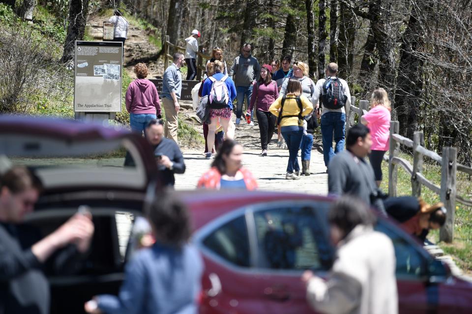 Visitors crowd the Newfound Gap parking lot Sunday in the Great Smoky Mountains National Park.