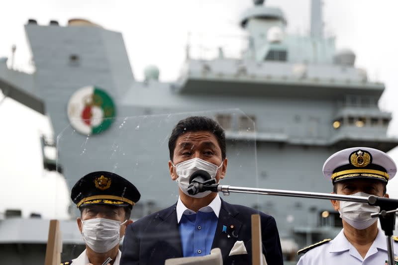 Japan's Defense Minister Nobuo Kishi tours the British Royal Navy's HMS Queen Elizabeth aircraft carrier in Yokosuka