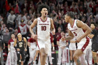 Arkansas forward Jaylin Williams (10) celebrates with teammate Au'Diese Toney (5) after making a basket against Texas A&M during the first overtime period of an NCAA college basketball game Saturday, Jan. 22, 2022, in Fayetteville, Ark. (AP Photo/Michael Woods)