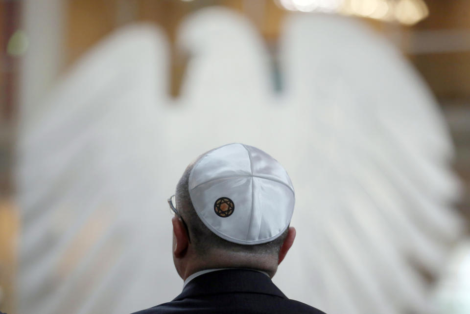 A visitor wearing a kippah attends a commemorative event for the victims of the Nazi era at the German Bundestag parliament in Berlin, Germany, Jan. 30, 2013.  (AP Photo/dpa, Kay Nietfeld)