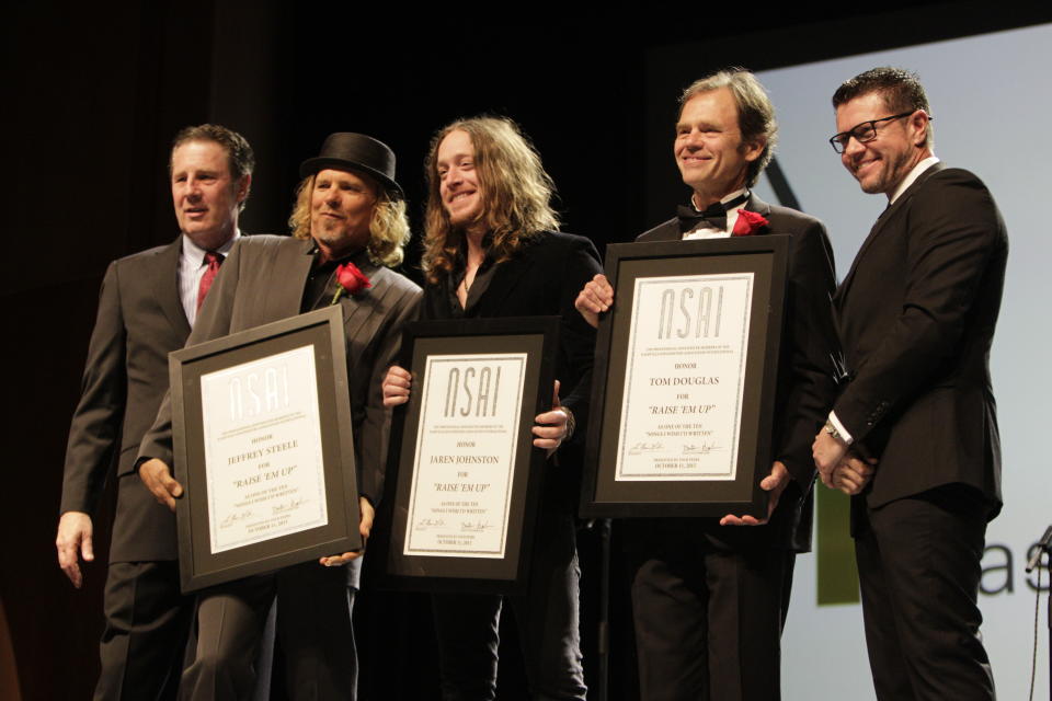 Bart Herbison, left, stands with Jeffrey Steele, Jaren Johnson, Tom Douglas and Lee Thomas Miller at The Nashville Songwriters Hall of Fame Dinner and Induction Ceremony at the Music City Center on Sunday, Oct. 11, 2015, in Nashville, Tenn. (Photo by Wade Payne/Invision/AP) - Credit: Wade Payne/Invision/AP