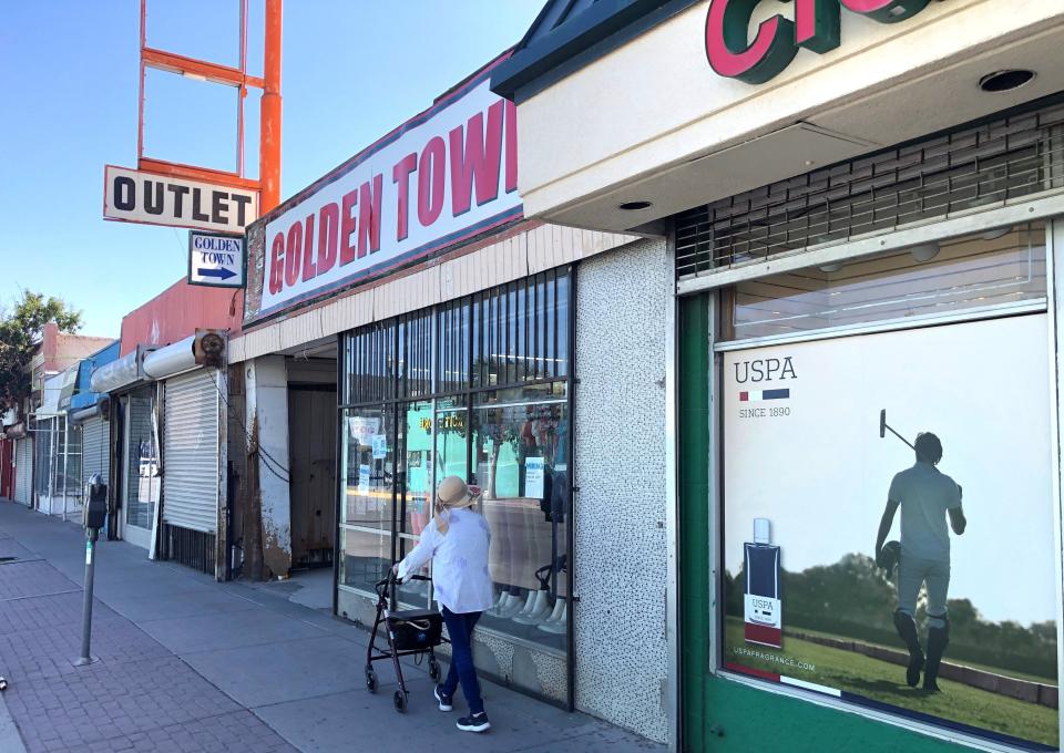 The building with the Golden Town store, which sells clothes and other items, at 809 S. Stanton St., in Downtown El Paso, as seen Oct. 16, is part of a nine-building purchase by a company tied to Dallas' Parking Systems of America. An Ueta Duty Free store is next door.