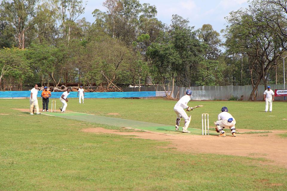 Cricketers during a game on September 7, 2014 at ETO Kicukiro, the former technical school of Kigali where thousands of Rwandans were killed during the 1994 genocide (AFP Photo/Stephanie Aglietti)